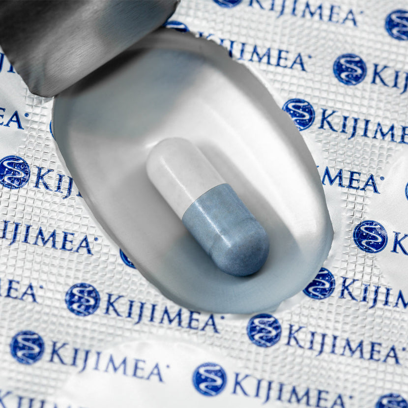 A Kjimea capsule laying in its packaging