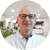A man wearing glasses and a lab coat
